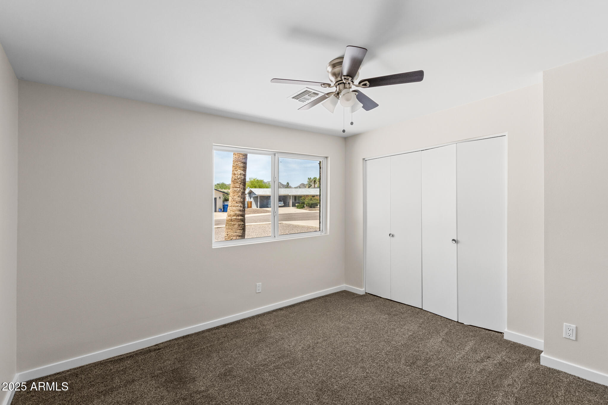 1911 East Lawrence Road Phoenix, AZ 85016 - Photo 30 of 49 a view of an empty room with a window