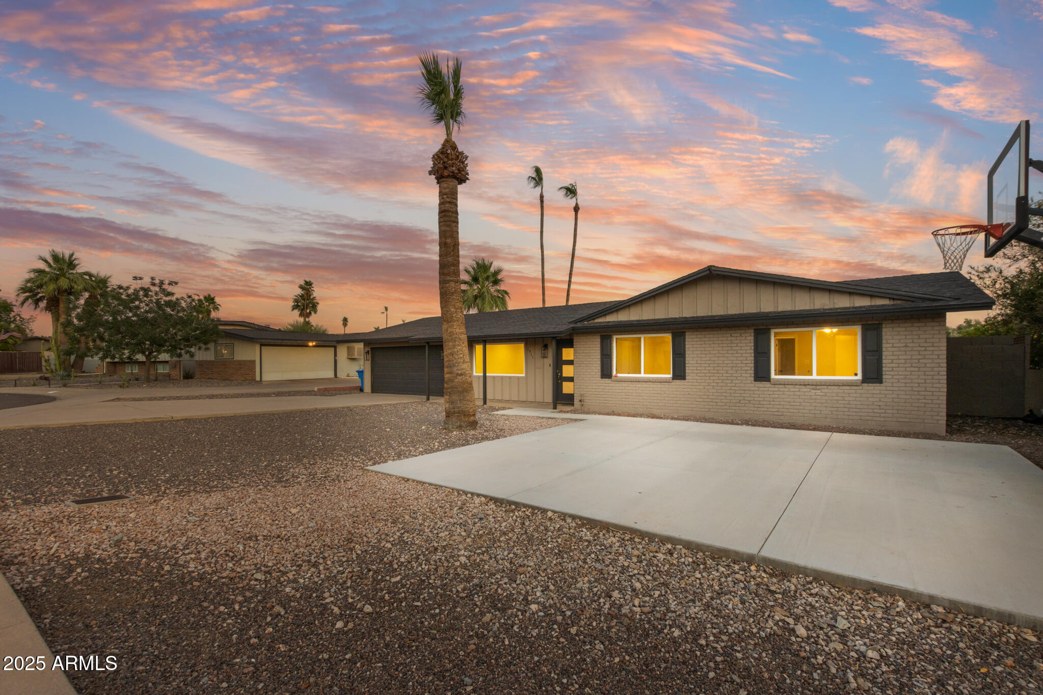 1911 East Lawrence Road Phoenix, AZ 85016 - Photo 3 of 49 a front view of a house with a yard and garage