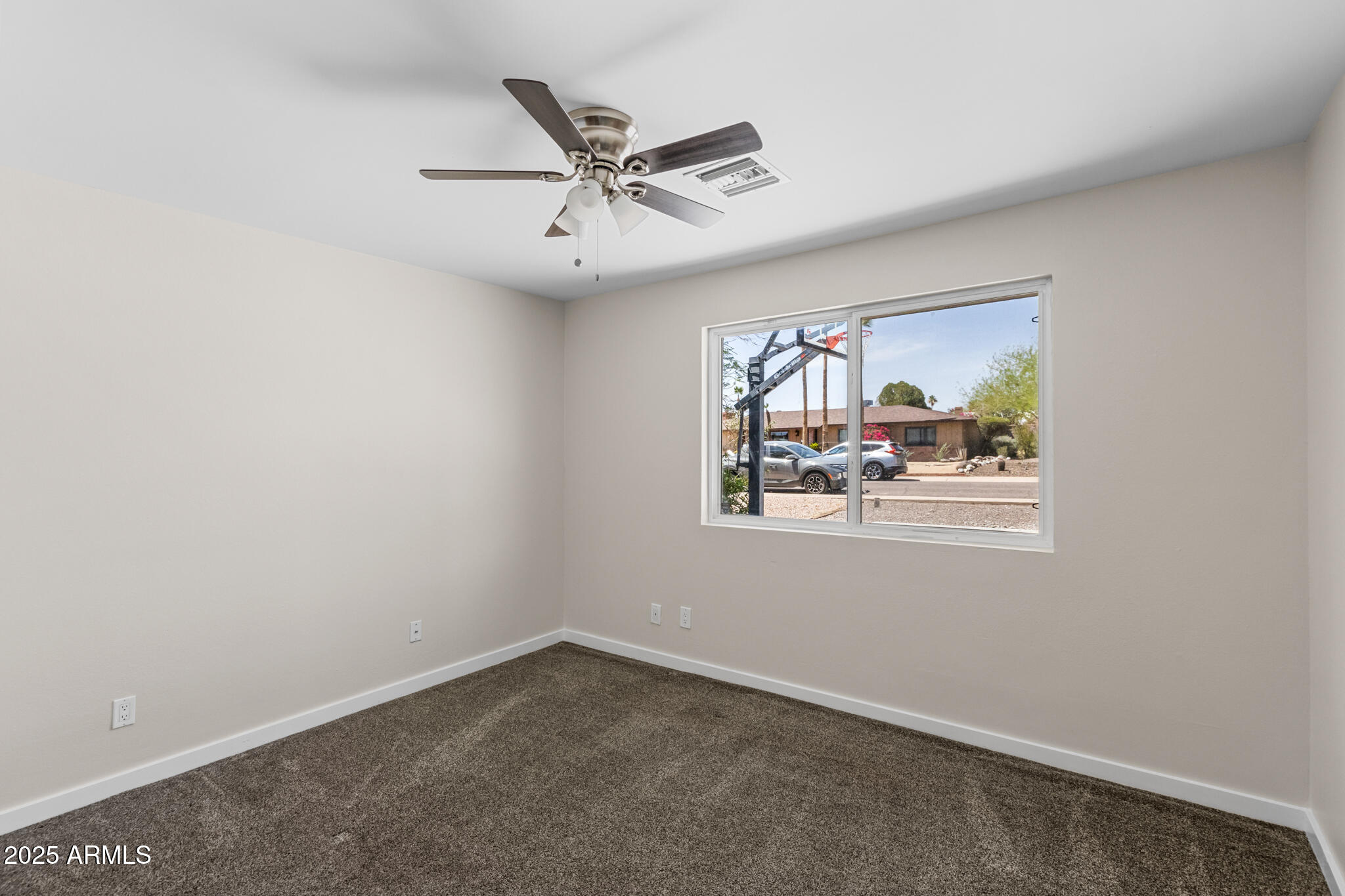 1911 East Lawrence Road Phoenix, AZ 85016 - Photo 32 of 49 an empty room with windows and fan