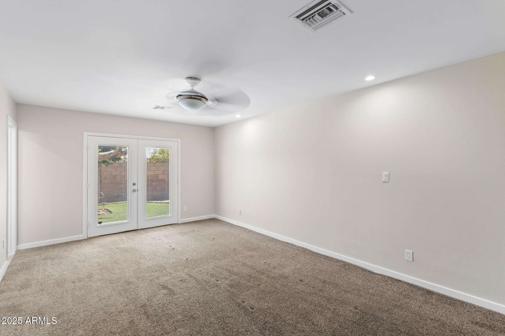 1911 East Lawrence Road Phoenix, AZ 85016 - Photo 34 of 49 wooden floor in an empty room with a window