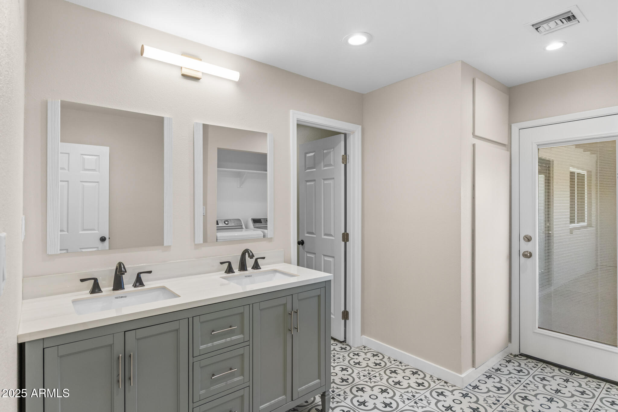 1911 East Lawrence Road Phoenix, AZ 85016 - Photo 39 of 49 a spacious bathroom with a shower sink and mirror