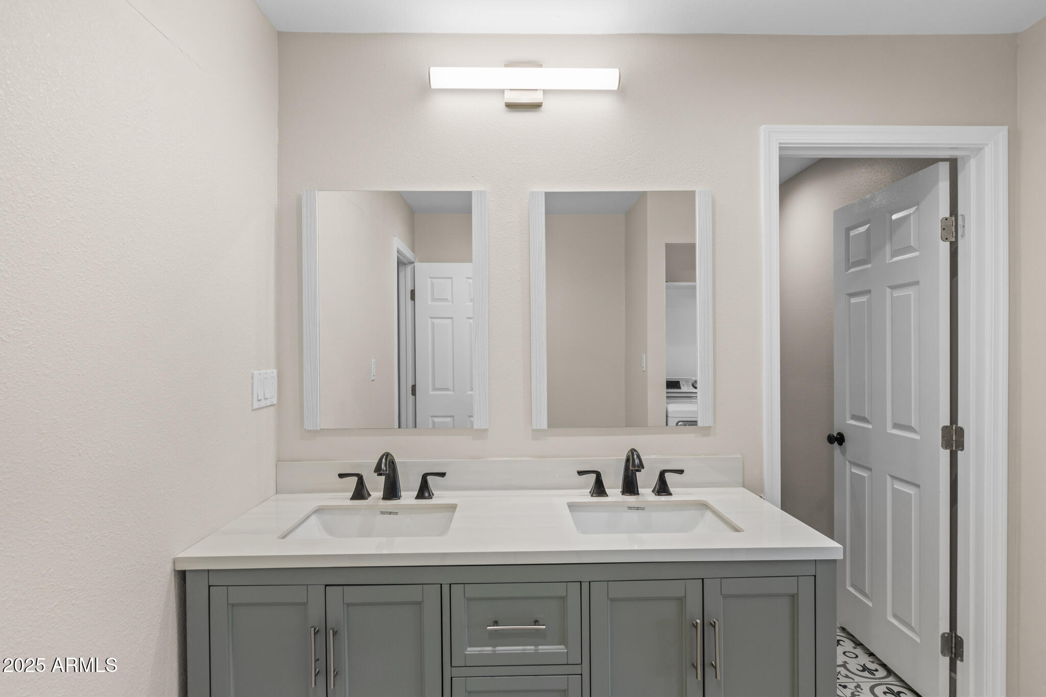 1911 East Lawrence Road Phoenix, AZ 85016 - Photo 40 of 49 a bathroom with a sink and a mirror