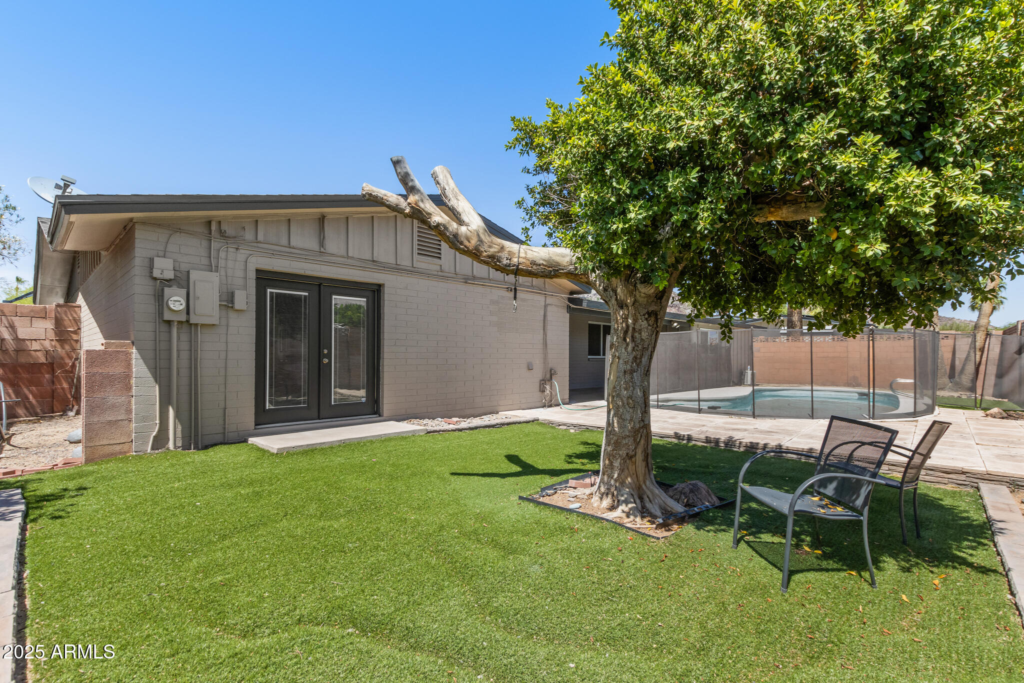 1911 East Lawrence Road Phoenix, AZ 85016 - Photo 48 of 49 a view of a house with backyard and a tree