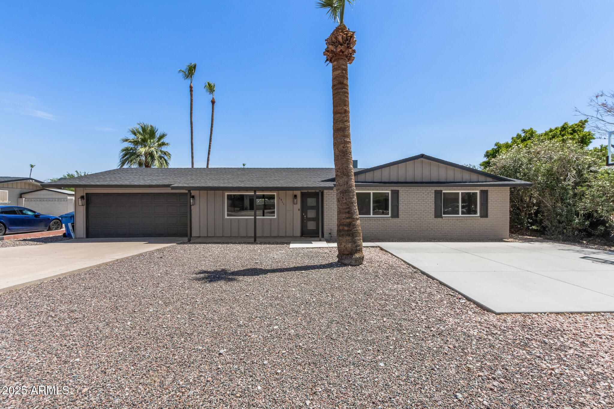 1911 East Lawrence Road Phoenix, AZ 85016 - Photo 5 of 49 a front view of a house with a garden