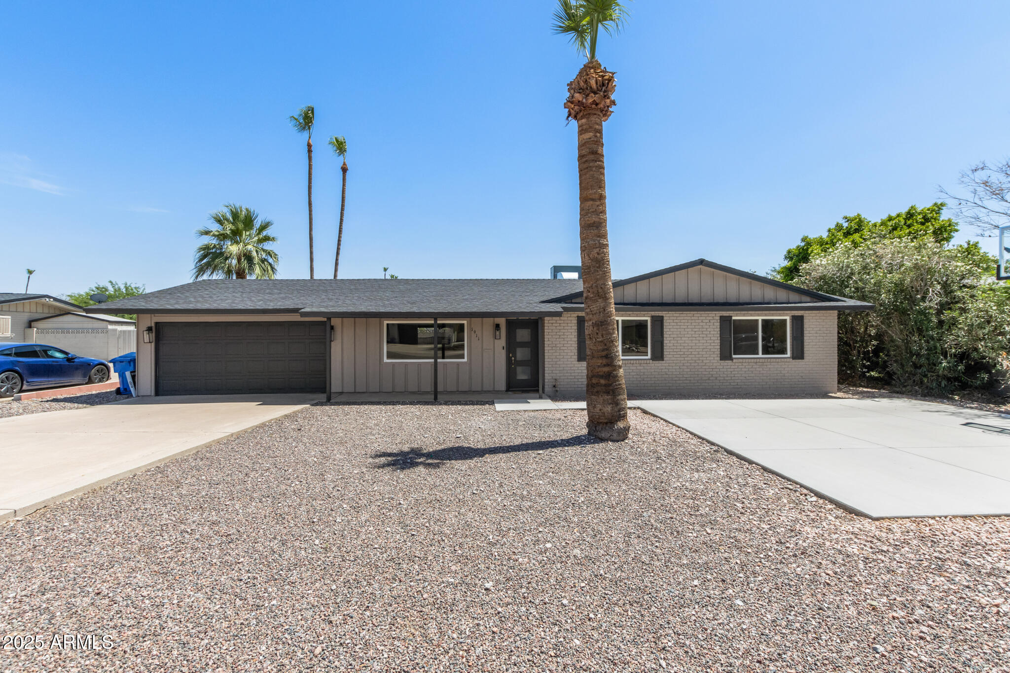 1911 East Lawrence Road Phoenix, AZ 85016 - Photo 6 of 49 a front view of a house with a yard and potted plants