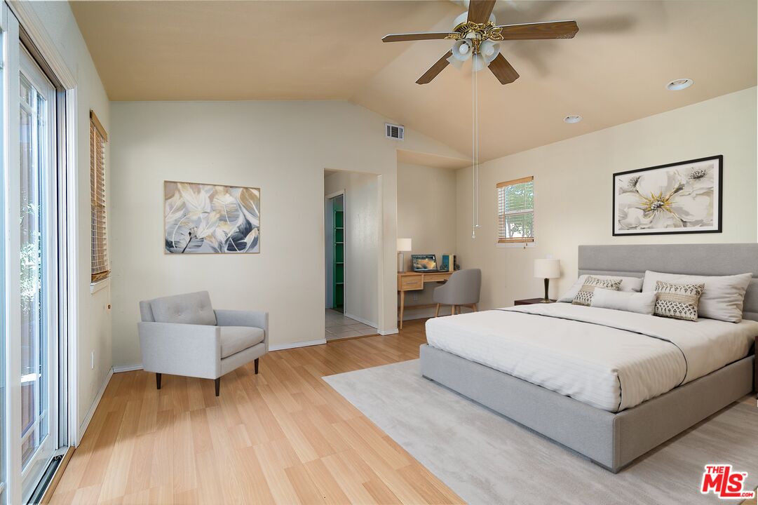 722 South McClelland Street Santa Maria, CA 93454 - Photo 12 of 27 a bedroom with a large bed and a chandelier