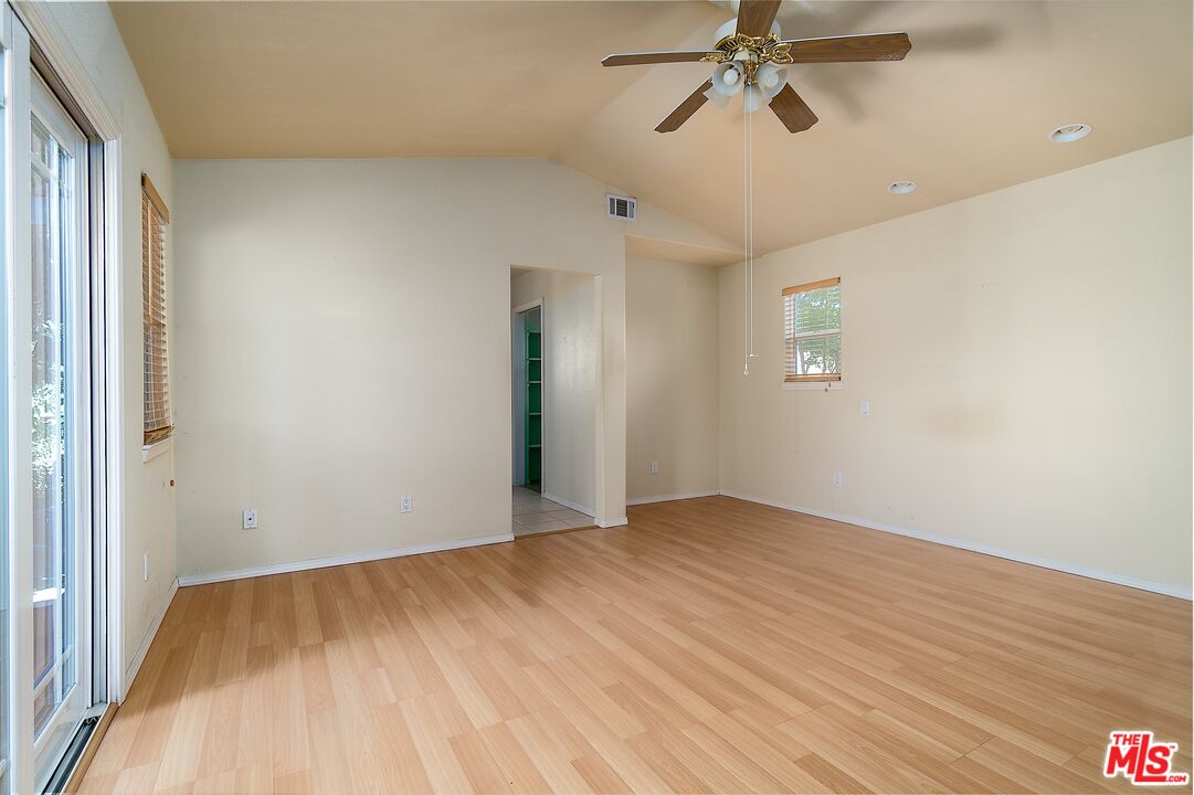 722 South McClelland Street Santa Maria, CA 93454 - Photo 13 of 27 a view of empty room with wooden floor and fan