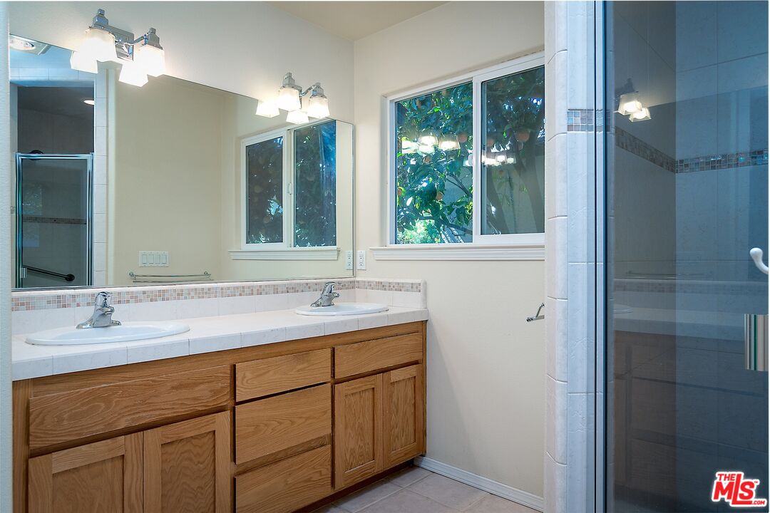 722 South McClelland Street Santa Maria, CA 93454 - Photo 15 of 27 a bathroom with a sink and a mirror