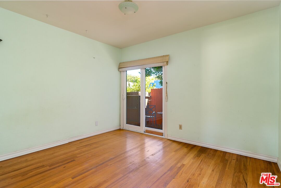722 South McClelland Street Santa Maria, CA 93454 - Photo 16 of 27 an empty room with wooden floor and windows
