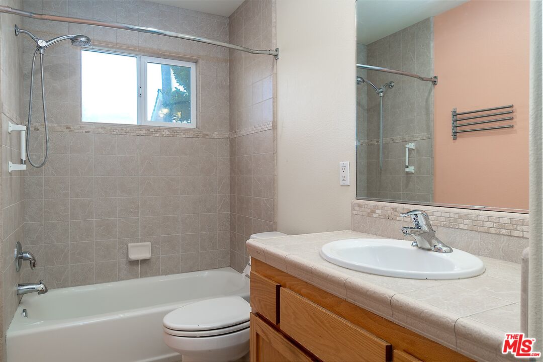 722 South McClelland Street Santa Maria, CA 93454 - Photo 18 of 27 a bathroom with a sink toilet and a bathtub