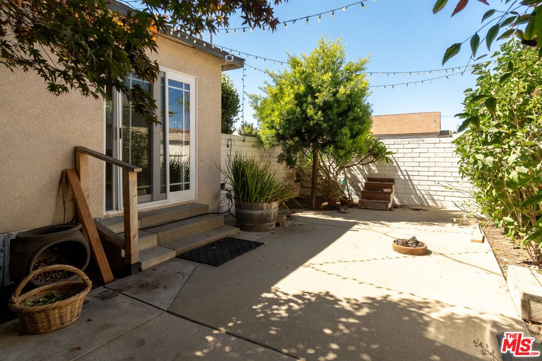 722 South McClelland Street Santa Maria, CA 93454 - Photo 20 of 27 a view of backyard with wheel chair potted plants and large tree