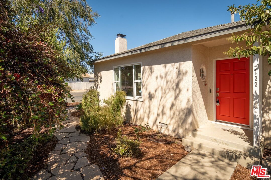 722 South McClelland Street Santa Maria, CA 93454 - Photo 25 of 27 a yellow house with trees in front of it