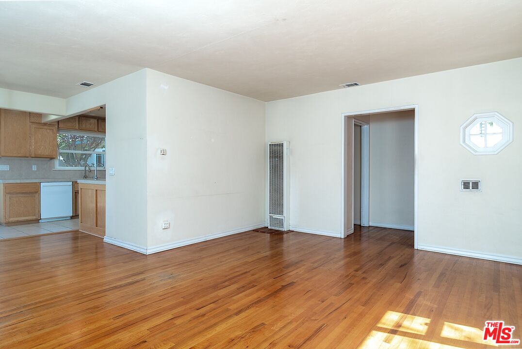 722 South McClelland Street Santa Maria, CA 93454 - Photo 5 of 27 a view of a kitchen with wooden floor