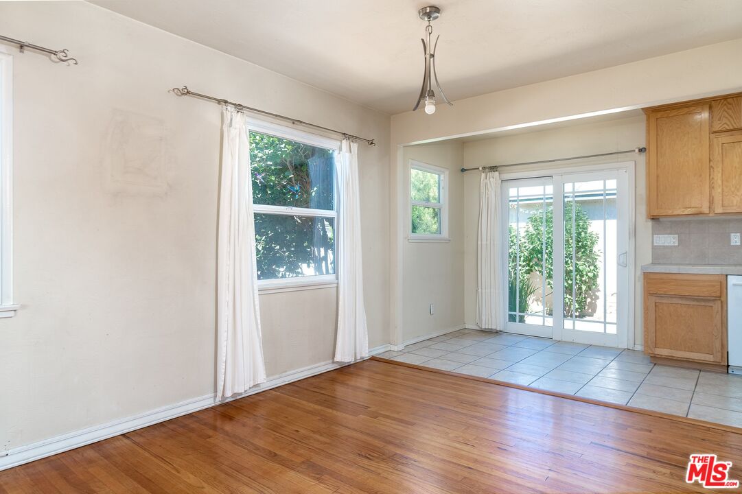 722 South McClelland Street Santa Maria, CA 93454 - Photo 7 of 27 a view of an empty room with wooden floor and a window