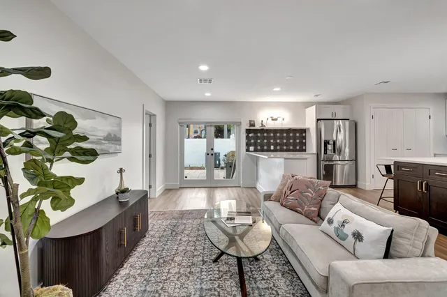 a living room with furniture and a rug