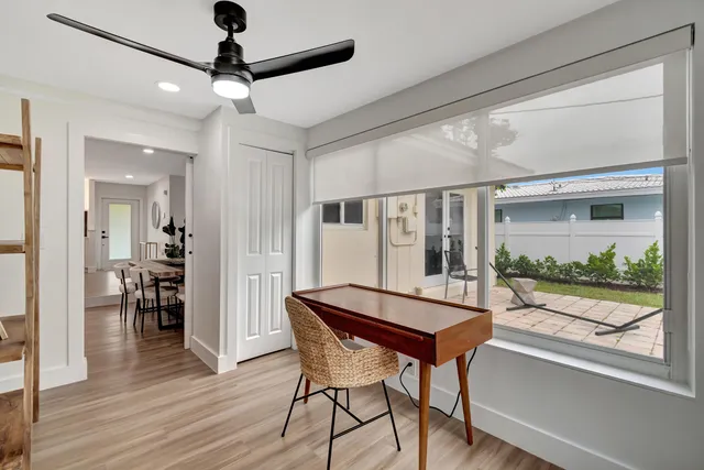 a dining room with furniture and window