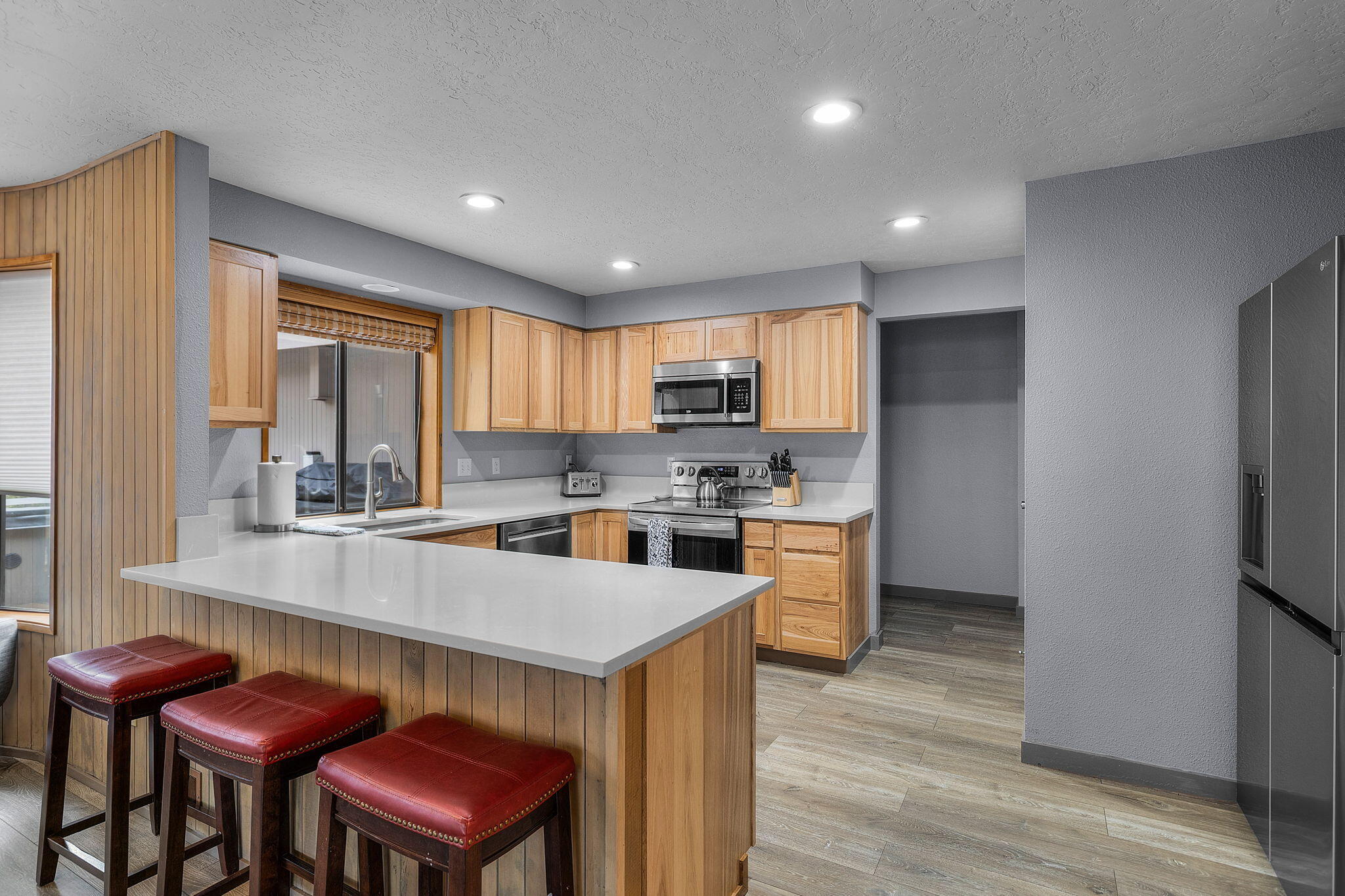 13168 Hawks Beard Black Butte Ranch, OR 97759 - Photo 2 of 47 a kitchen with cabinets and wooden floor