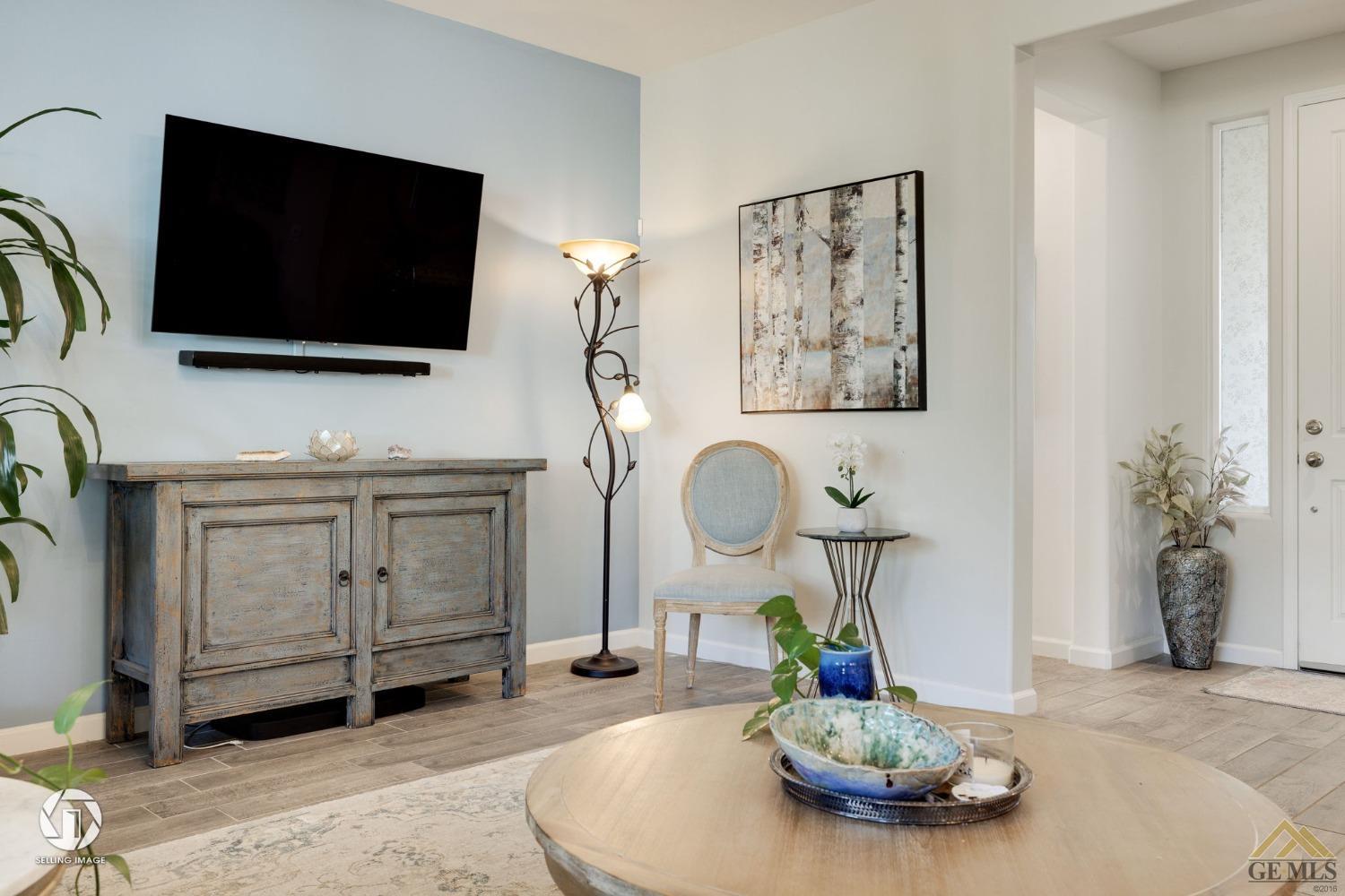 Undisclosed Address Bakersfield, CA 93311 - Photo 15 of 49 a living room with furniture and flat screen tv