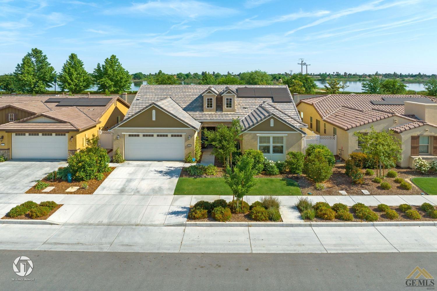 Undisclosed Address Bakersfield, CA 93311 - Photo 2 of 49 a front view of house with yard and green space