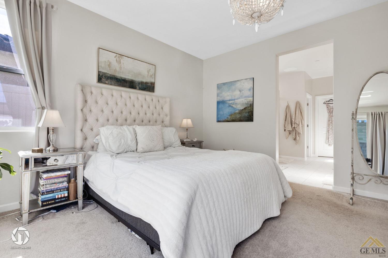 Undisclosed Address Bakersfield, CA 93311 - Photo 29 of 49 a bedroom with a bed and a night stand