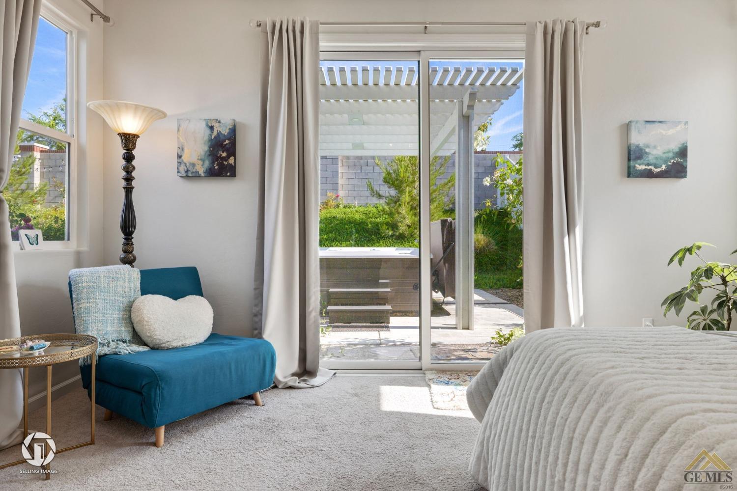 Undisclosed Address Bakersfield, CA 93311 - Photo 30 of 49 a bedroom with a bed and a large window