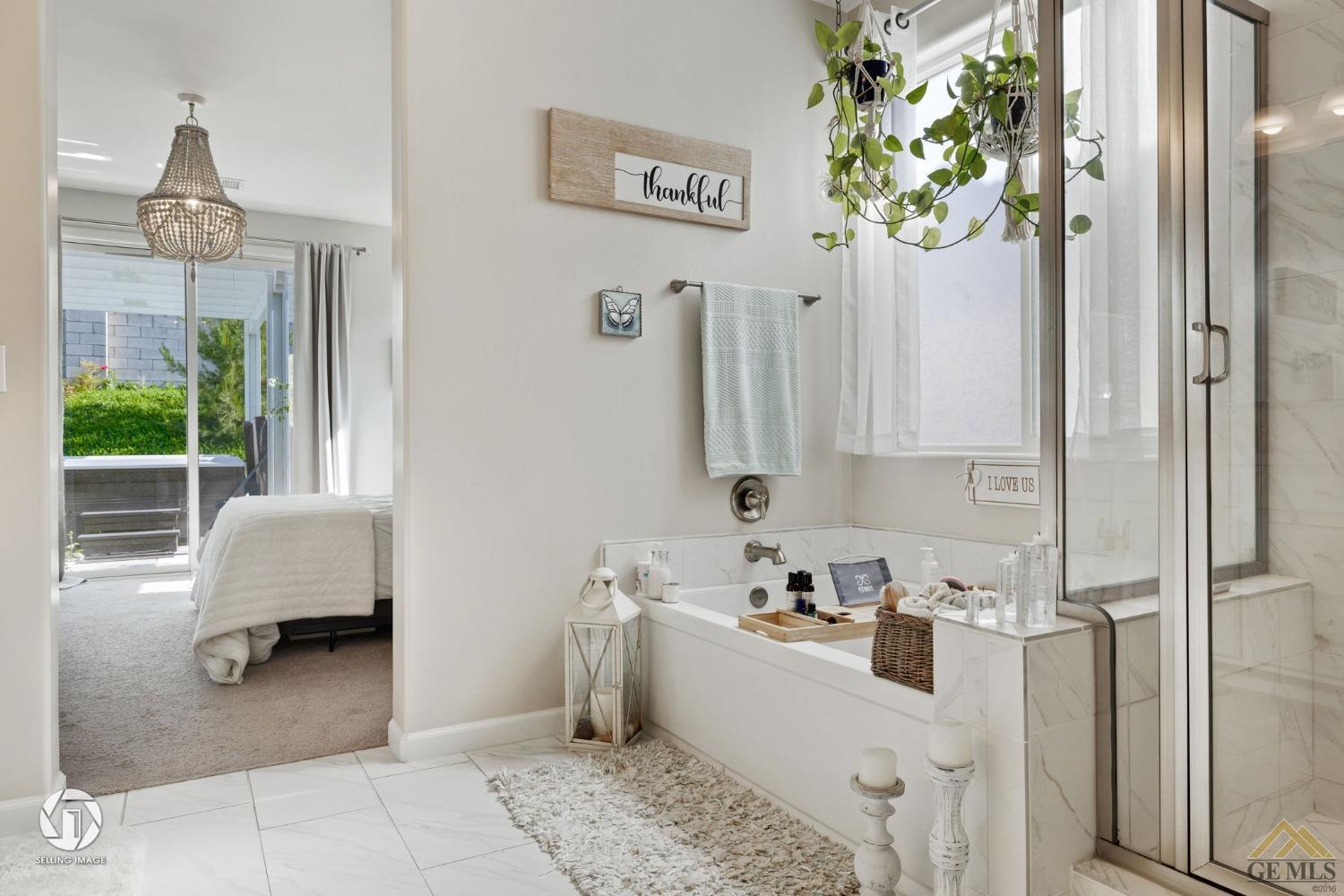 Undisclosed Address Bakersfield, CA 93311 - Photo 32 of 49 a bathroom with a tub sink and mirror