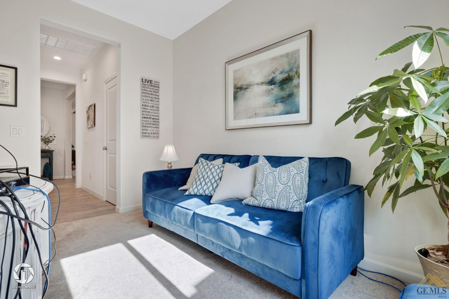 Undisclosed Address Bakersfield, CA 93311 - Photo 35 of 49 a living room with furniture and a potted plant