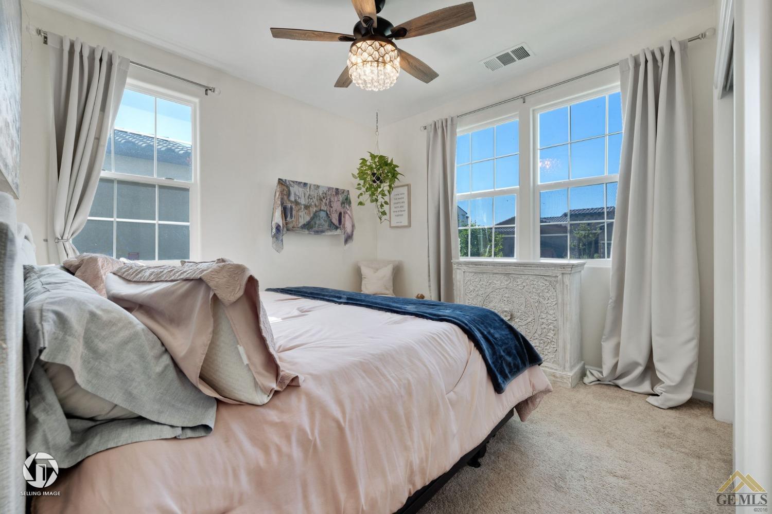 Undisclosed Address Bakersfield, CA 93311 - Photo 38 of 49 a bedroom with a bed and a window