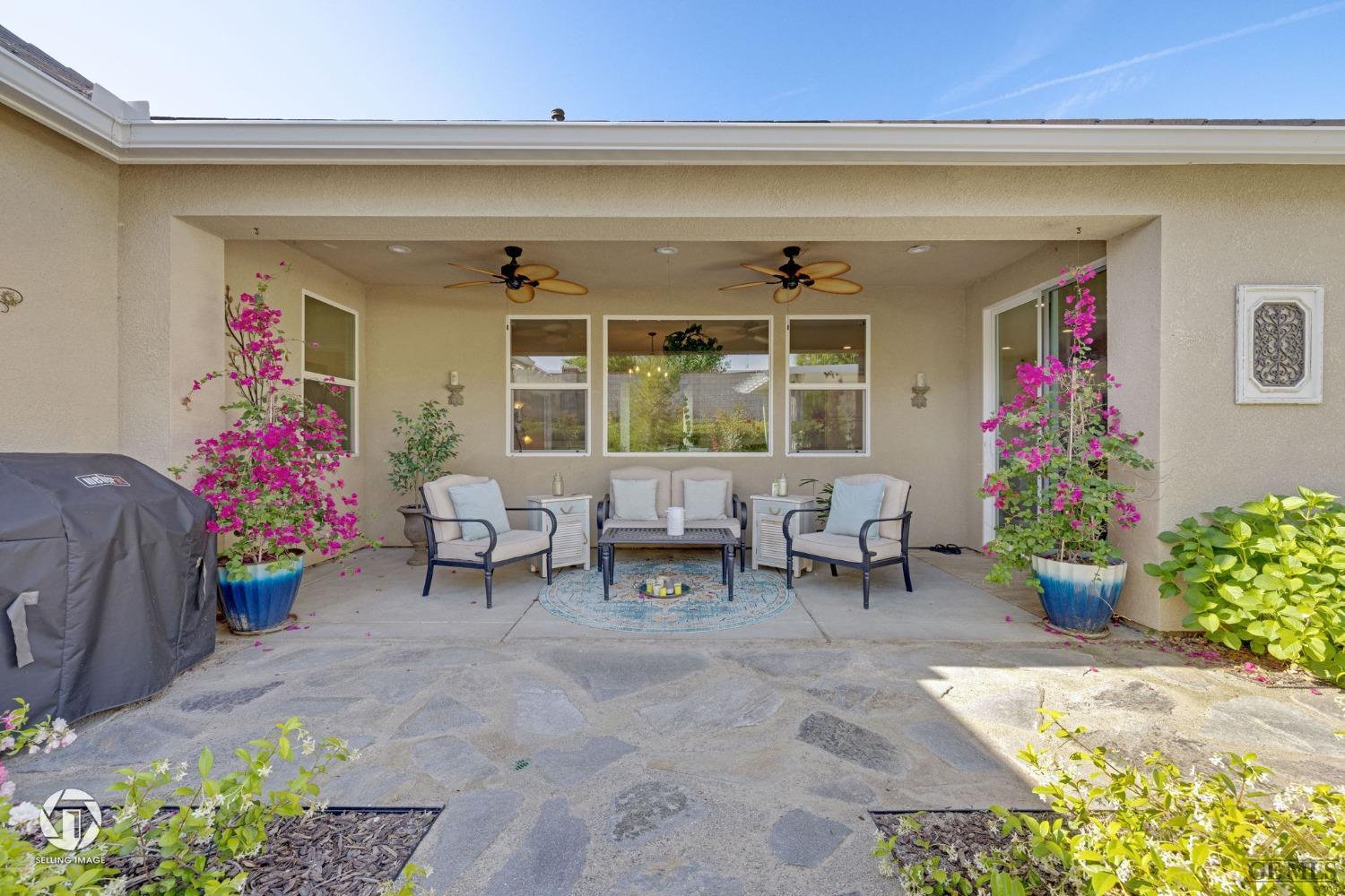 Undisclosed Address Bakersfield, CA 93311 - Photo 40 of 49 a living room filled with furniture and a potted plant