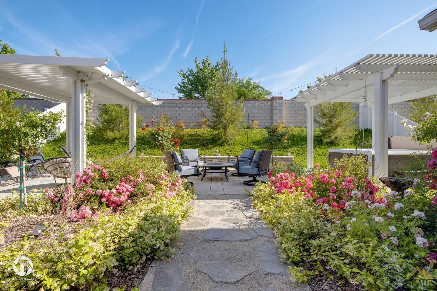 Undisclosed Address Bakersfield, CA 93311 - Photo 41 of 49 a view of a patio with table and chairs and potted plants