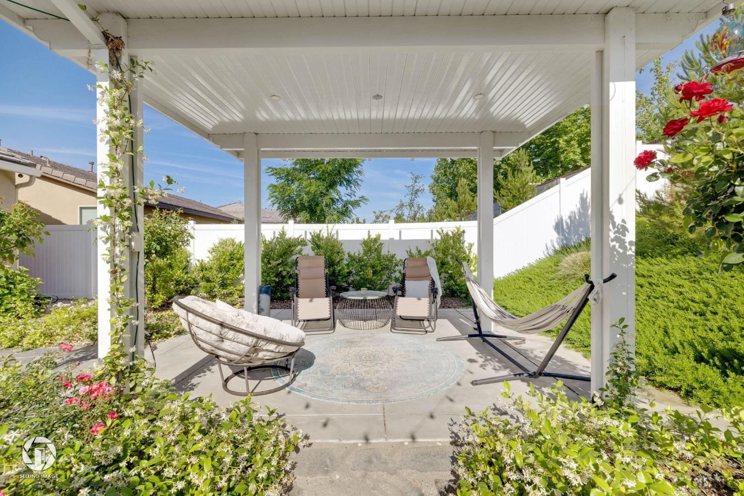Undisclosed Address Bakersfield, CA 93311 - Photo 43 of 49 a view of an chair and tables in the patio