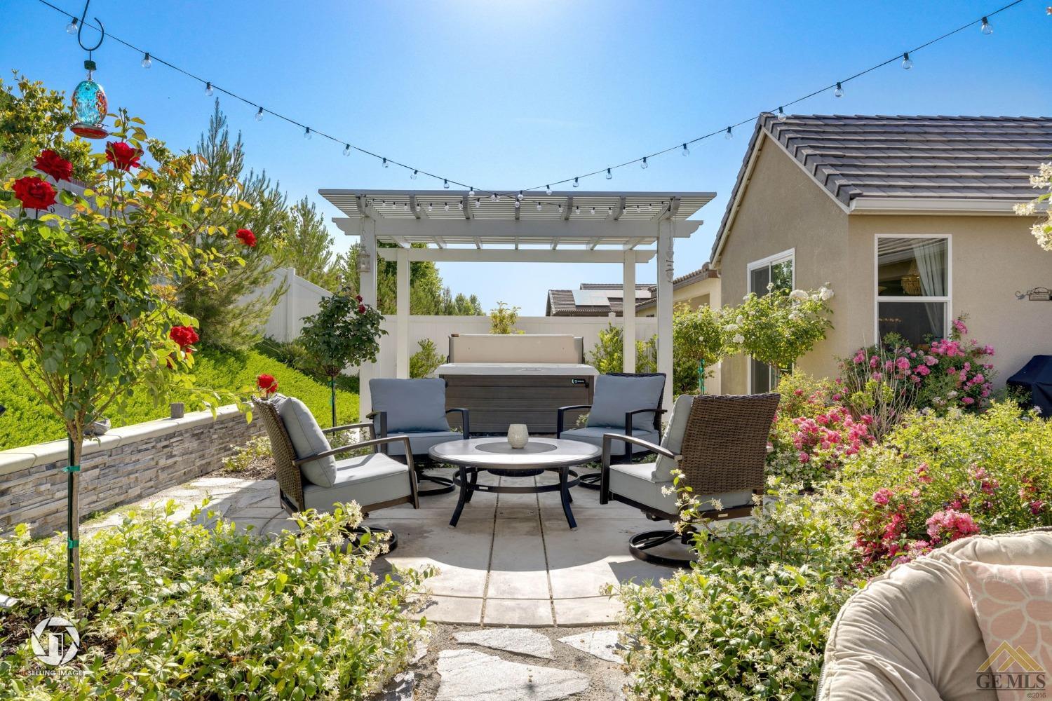 Undisclosed Address Bakersfield, CA 93311 - Photo 44 of 49 a view of a patio with table and chairs potted plants