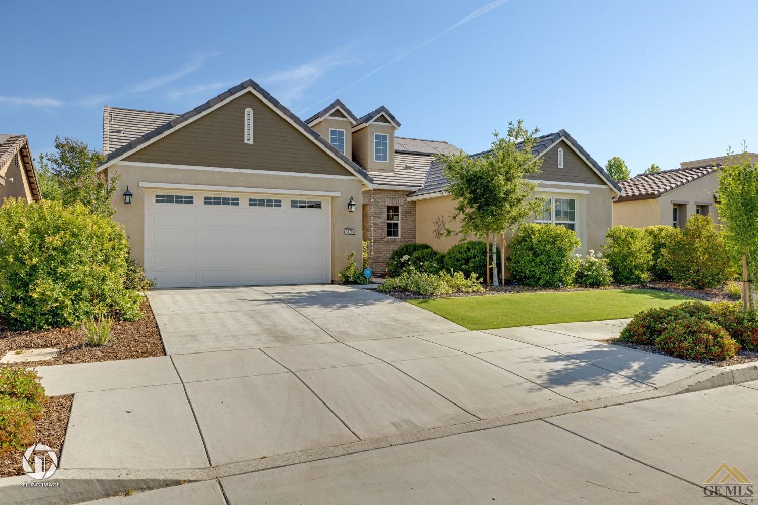 Undisclosed Address Bakersfield, CA 93311 - Photo 5 of 49 a front view of a house with garden