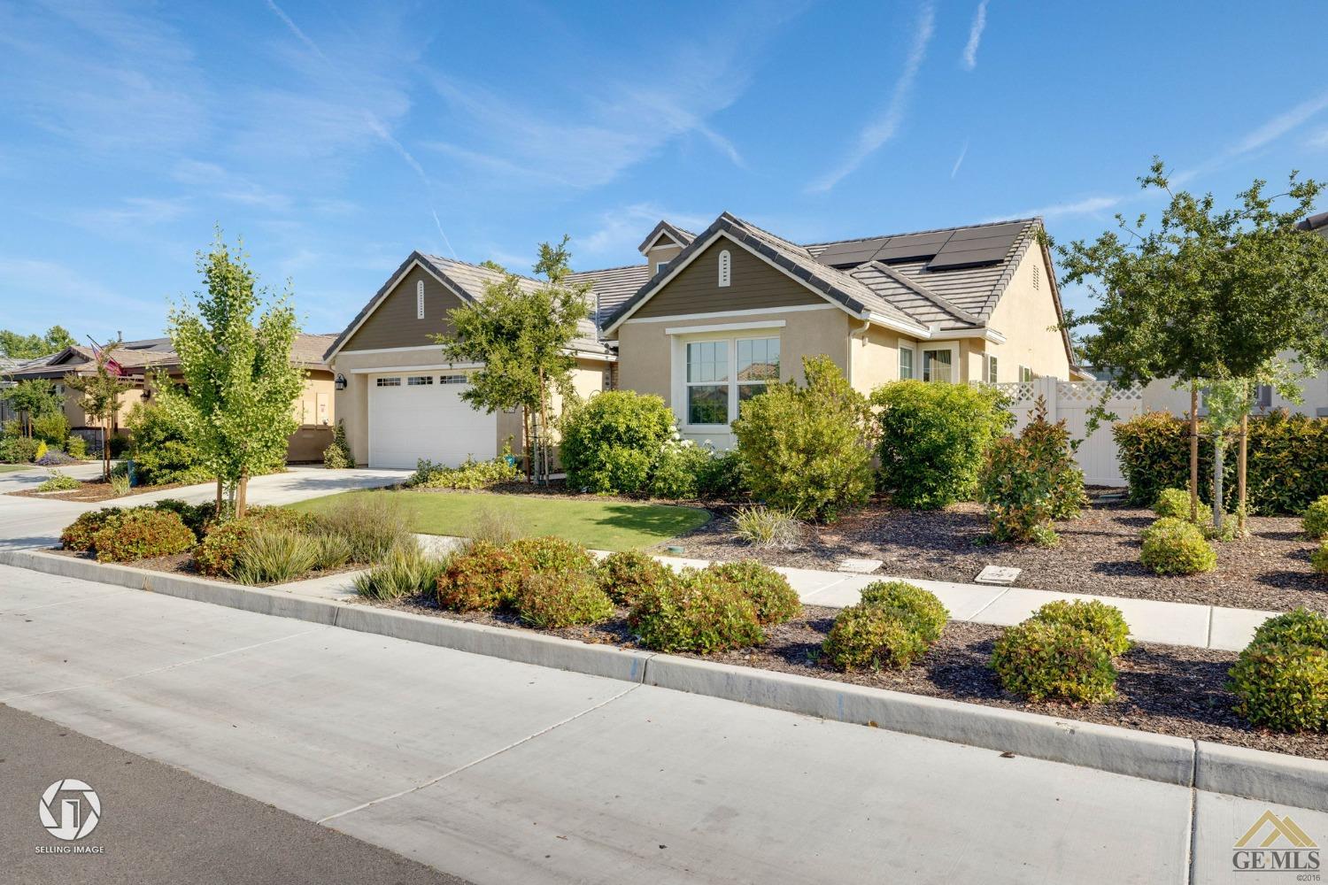Undisclosed Address Bakersfield, CA 93311 - Photo 6 of 49 a front view of a house with a yard