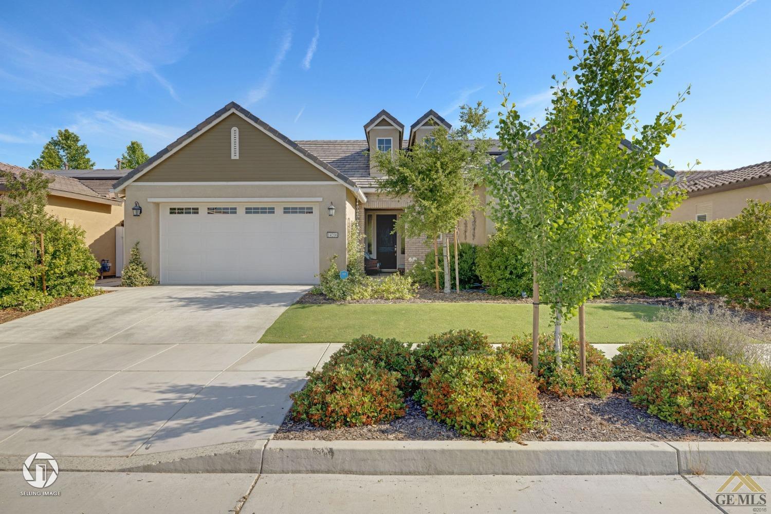 Undisclosed Address Bakersfield, CA 93311 - Photo 7 of 49 a front view of a house with garden