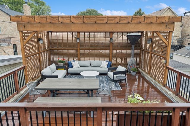a view of balcony with couch and wooden fence