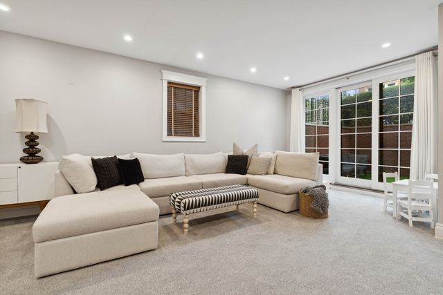 a living room with furniture and windows