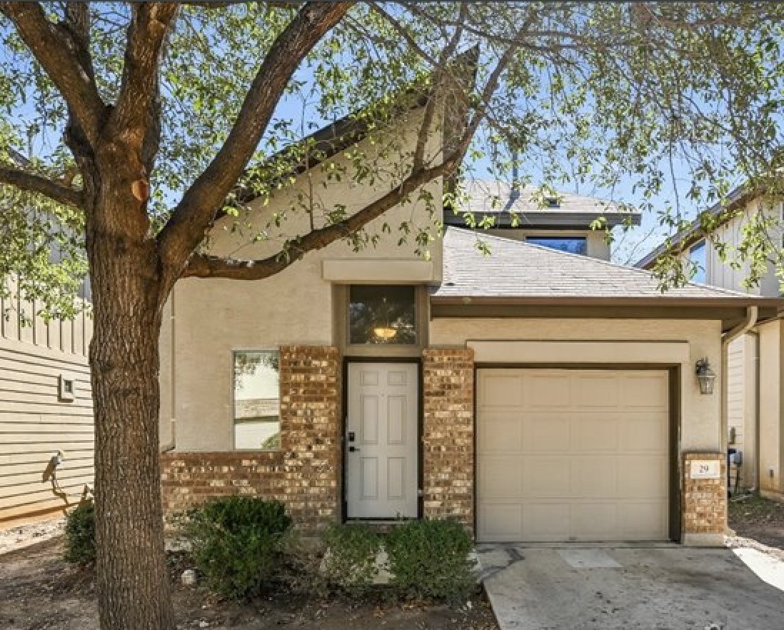2101 Rivers Edge Way, Unit 29 Austin, TX 78741 - Photo 1 of 34 a front view of a house with garden