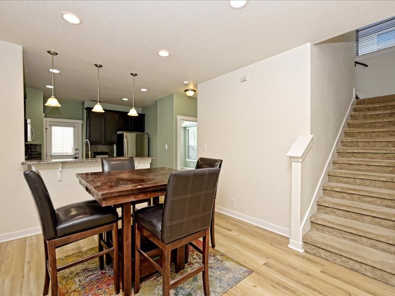 2101 Rivers Edge Way, Unit 29 Austin, TX 78741 - Photo 12 of 34 a dining room with furniture and wooden floor