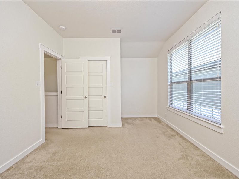2101 Rivers Edge Way, Unit 29 Austin, TX 78741 - Photo 23 of 34 an empty room with windows