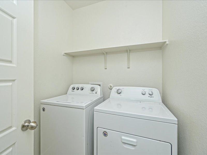 2101 Rivers Edge Way, Unit 29 Austin, TX 78741 - Photo 31 of 34 a utility room with dryer and washer