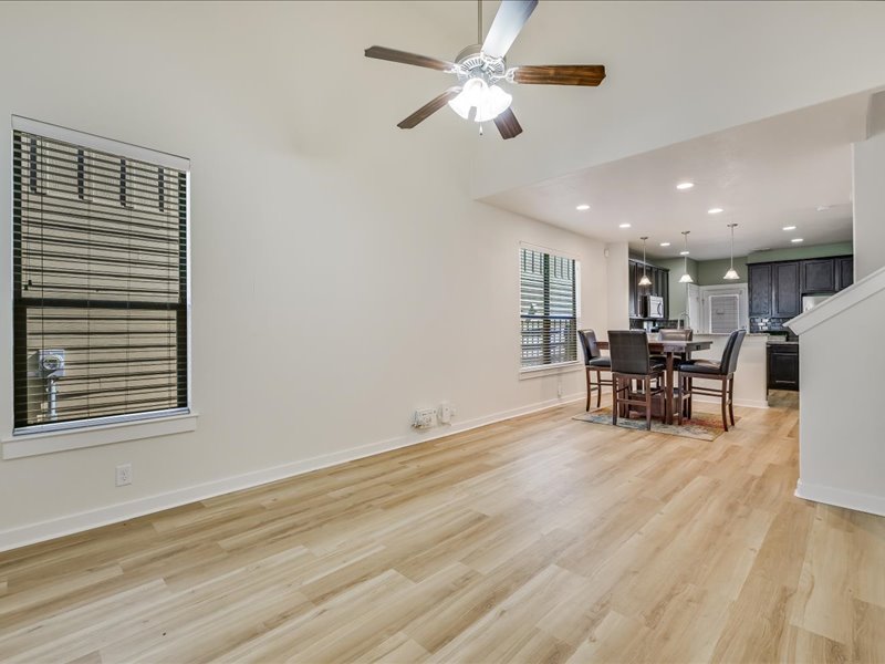 2101 Rivers Edge Way, Unit 29 Austin, TX 78741 - Photo 34 of 34 a view of a room with furniture and wooden floor