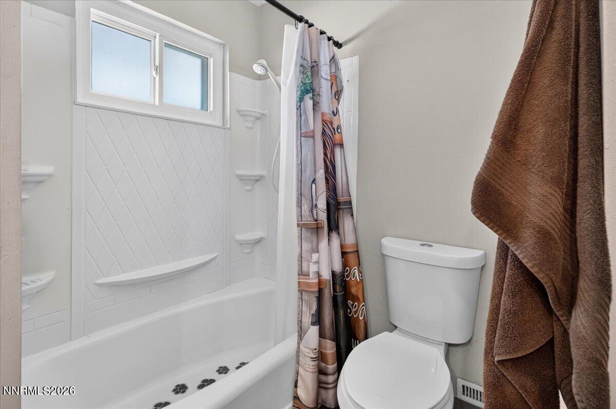 5 Smithridge Park Reno, NV 89502 - Photo 19 of 24 a white toilet sitting next to a bath tub