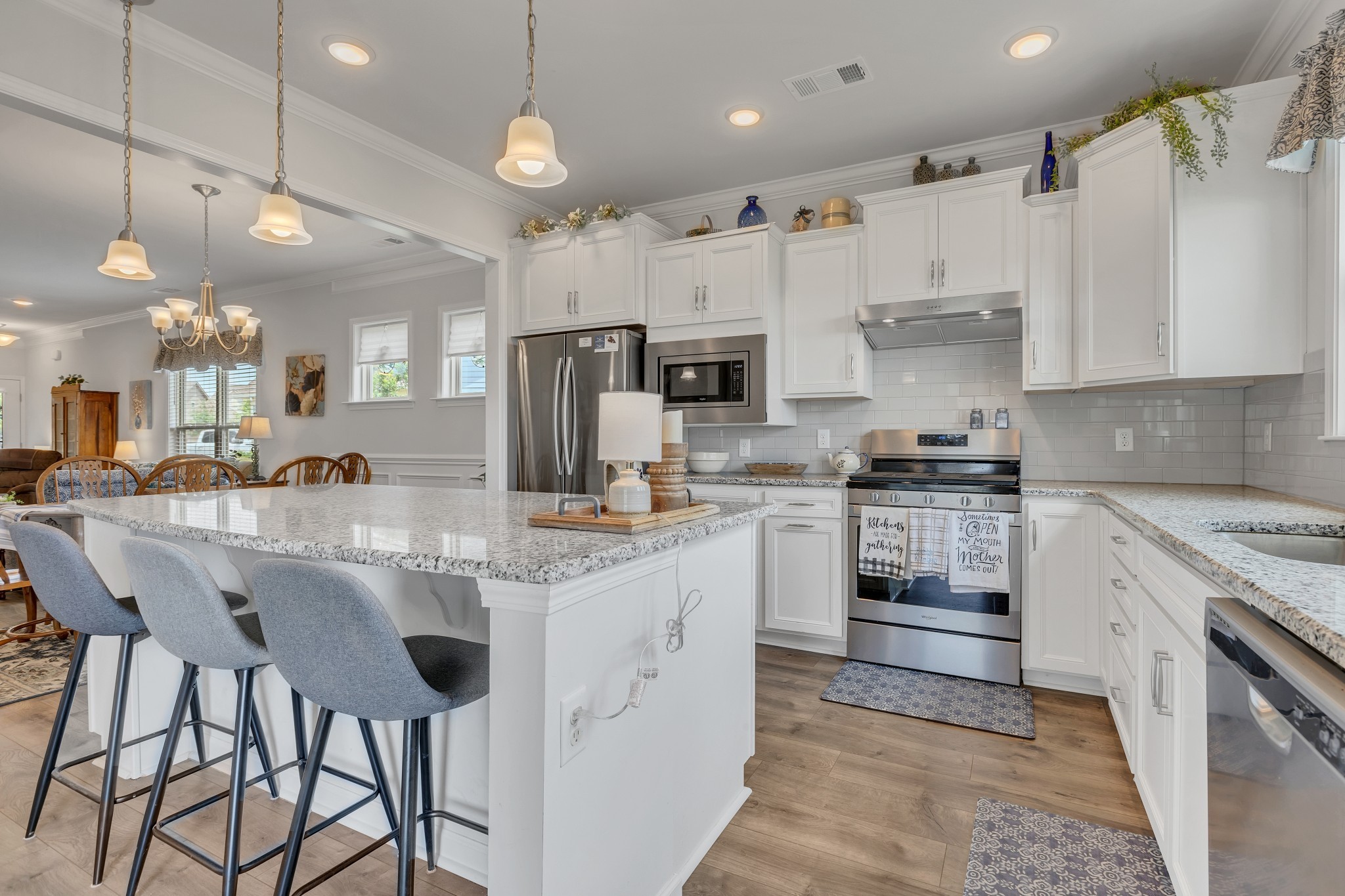 1514 Bledsoe Knoll Spring Hill, TN 37174 - Photo 17 of 47 a kitchen with stainless steel appliances kitchen island granite countertop a sink and cabinets