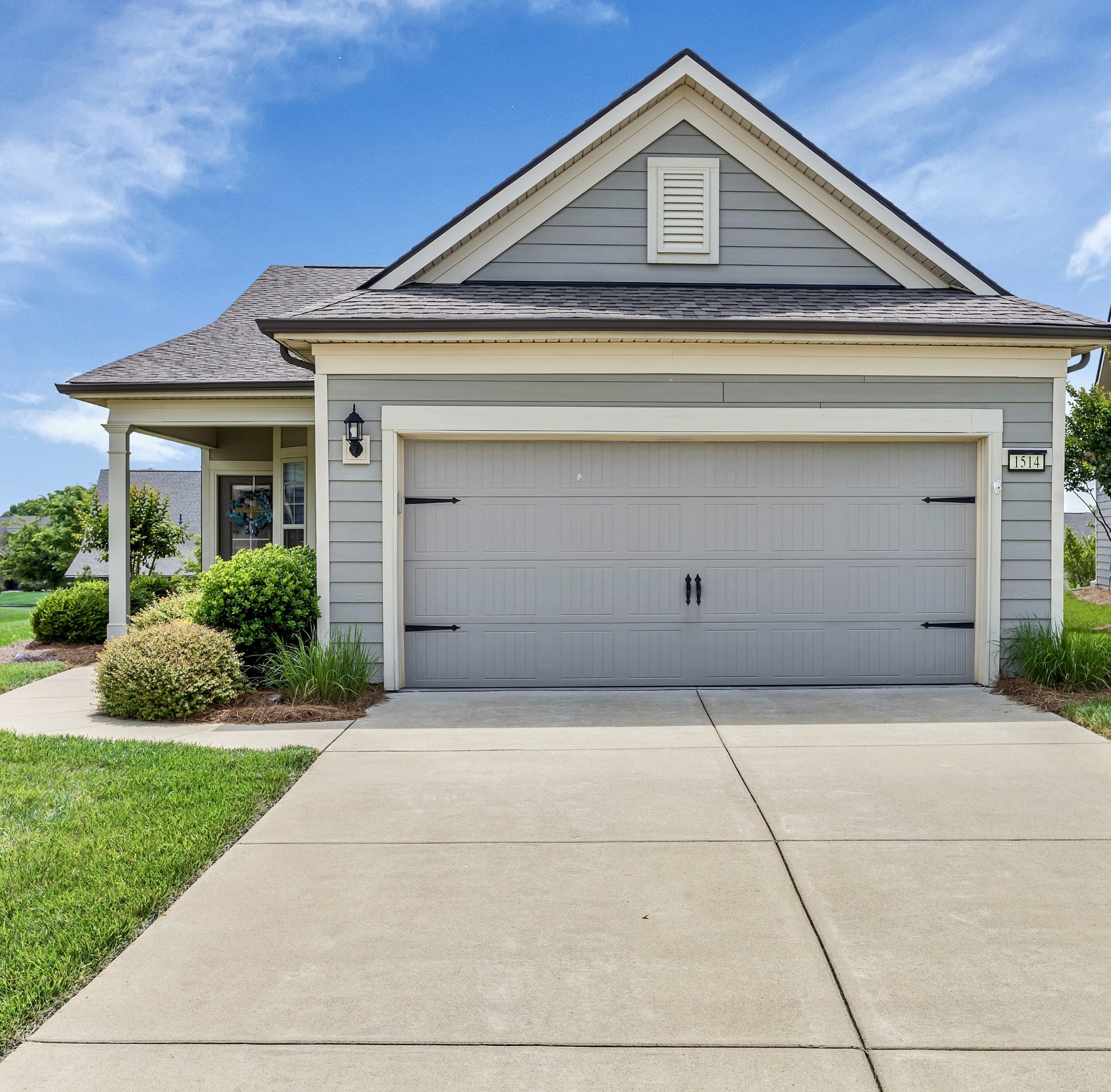 1514 Bledsoe Knoll Spring Hill, TN 37174 - Photo 2 of 47 a front view of a house with a yard