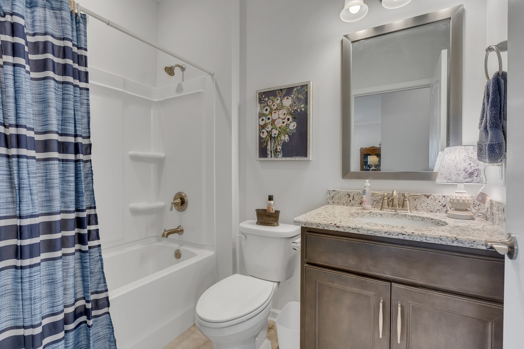 1514 Bledsoe Knoll Spring Hill, TN 37174 - Photo 23 of 47 a bathroom with a granite countertop sink toilet and shower