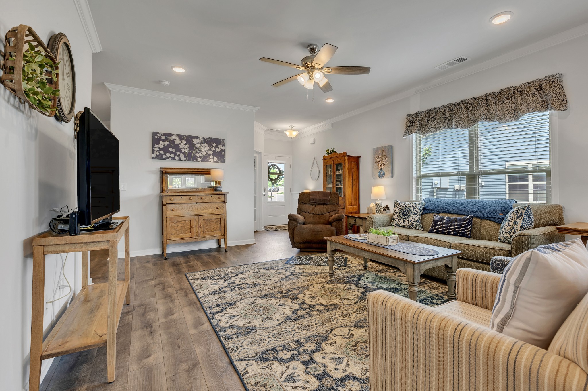 1514 Bledsoe Knoll Spring Hill, TN 37174 - Photo 10 of 47 a living room with furniture and a flat screen tv