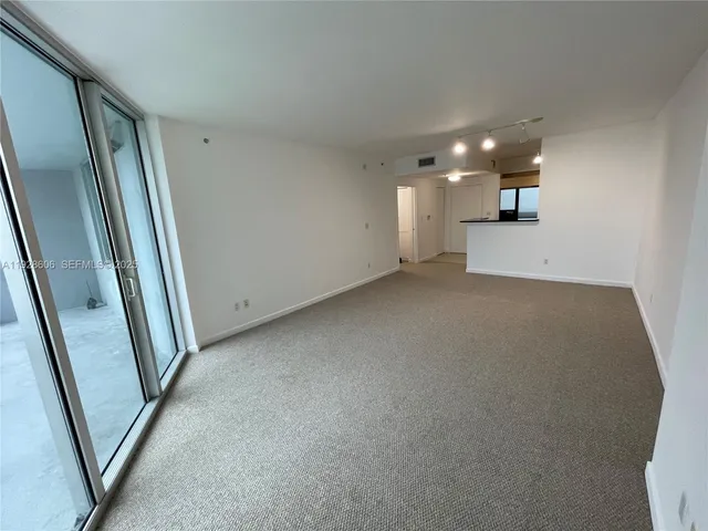 a view of a hallway to a room