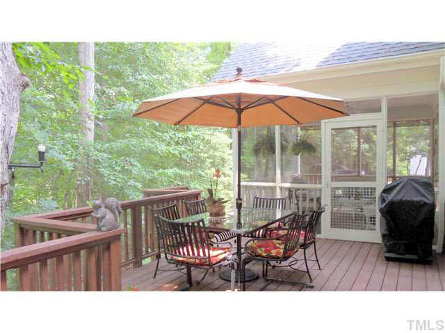 10415 Hallingdale Court Raleigh, NC 27614 - Photo 6 of 25 Large screened porch with ceiling fan overlooking wooded yard Screened Porch