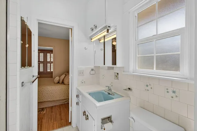 a kitchen with stainless steel appliances granite countertop a stove and a microwave